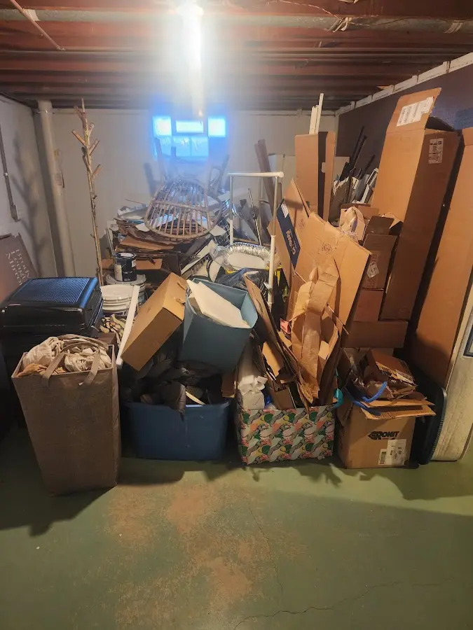 Roll-off dumpster container at job site for 2 Yard Dumpster Rental in Black River Falls